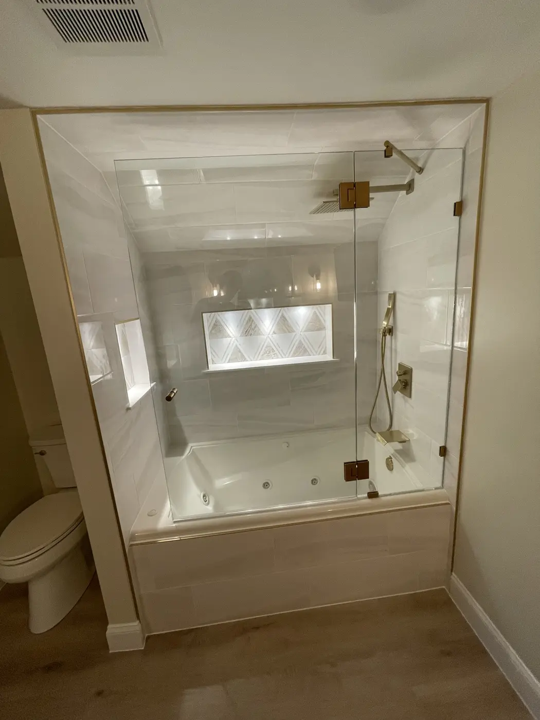 Jetted tub shower conversion with custom niche