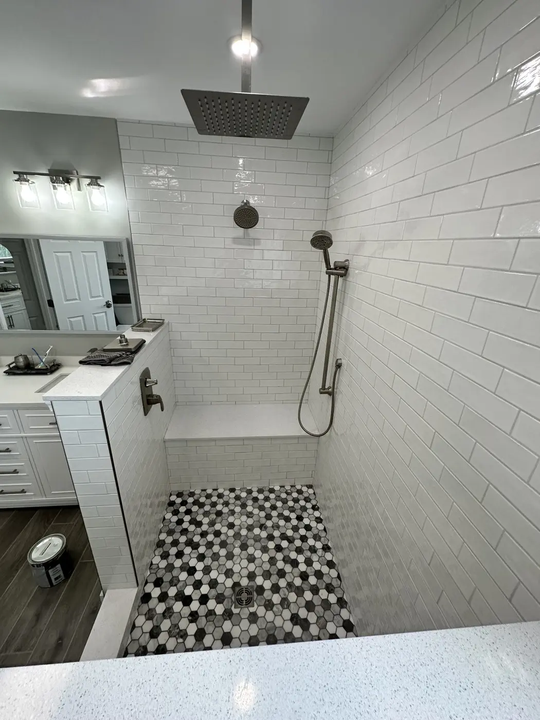 White subway tile shower with rainfall showerhead